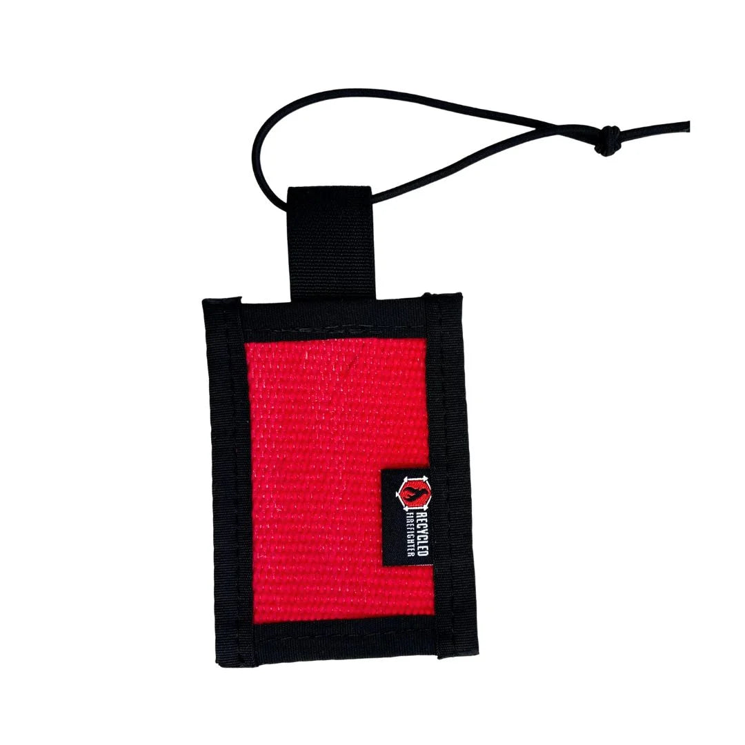 Recycled Firefighter firehose luggage tag in red with black nylon binding and elastic cord, durable upcycled travel accessory made in USA