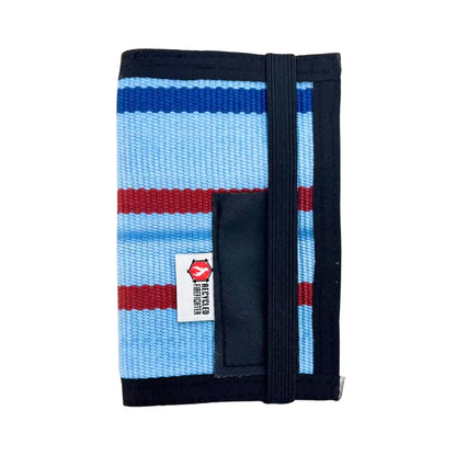 The Inspector recycled firehose notebook cover in Limited Edition Ocean Breeze 'Merica – light blue, red, and navy stripe fire hose with black elastic closure and pen sleeve, one-of-a-kind upcycled design