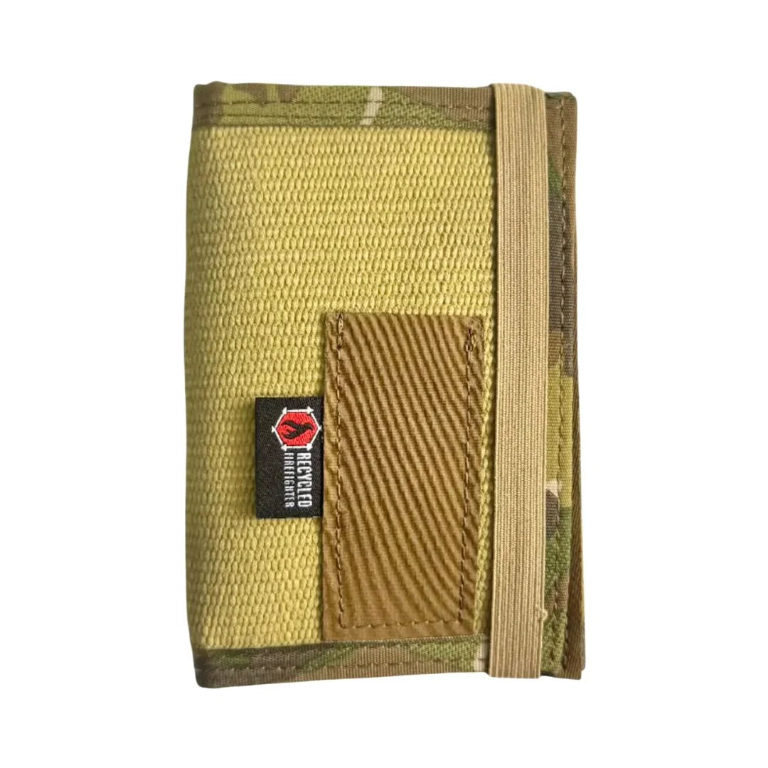 The Inspector recycled firehose notebook cover in Yellow and Black – closed front view showing woven fire hose texture, black military nylon webbing edging, and pen sleeve, made in USA by Recycled Firefighter