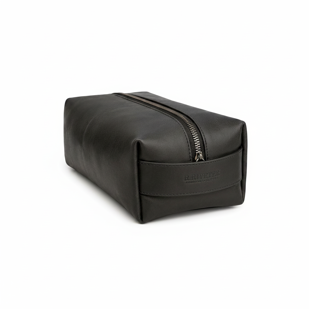 Black leather toiletry bag with a zipper on a white background